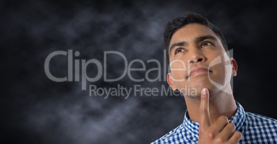 Man looking up with dark background