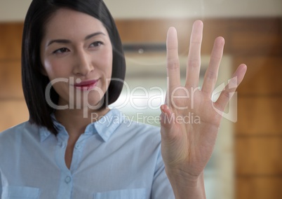 Businesswoman touching air in front of elevator