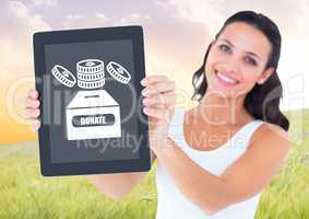 Woman holding tablet with donate box and money icon for charity
