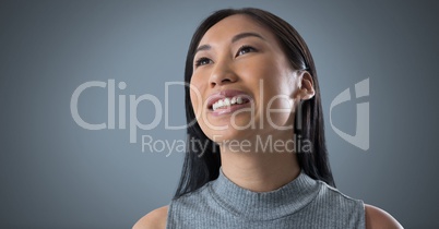 Woman looking up with grey background