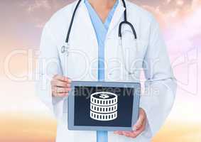 Doctor holding tablet with money icon