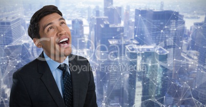 Man looking up with city interconnected background