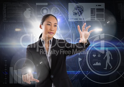 Businesswoman touching air in front of science technology interfaces