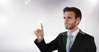 Businessman touching air in front of white background