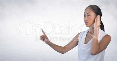 Businesswoman touching air in front of white background