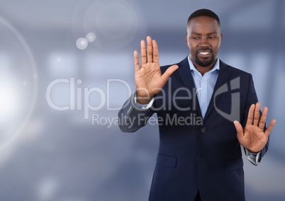 Businessman touching air in front of office