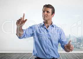 Businessman touching air in front of city