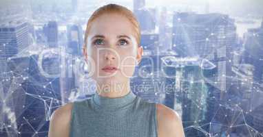 Woman looking up with interconnected city background
