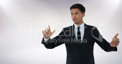 Businessman touching air with hand gestures in front of white background