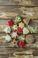 Gingerbread cookies arranged on wooden plank
