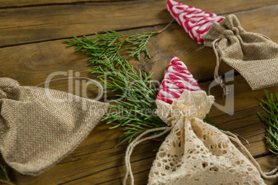 High angle view of mint candies in jute sack with twigs