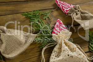 High angle view of mint candies in jute sack with twigs