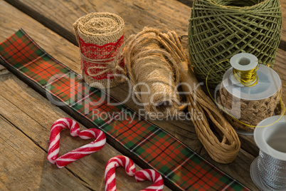 High angle view of thread spools with candy cane