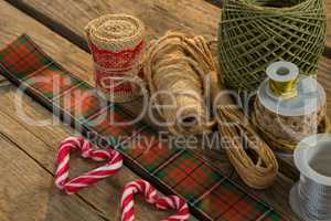High angle view of thread spools with candy cane