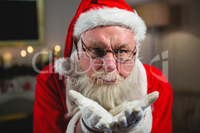 Santa Claus blowing kiss