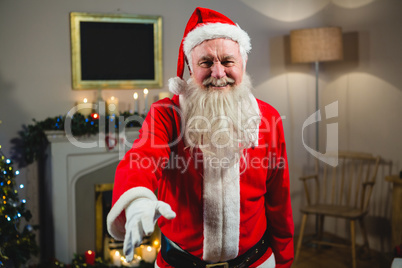 Portrait of smiling Santa Claus gesturing