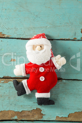 Handmade santa on wooden plank