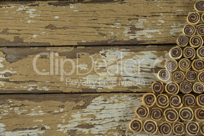 Chocolate cookies arranged on wooden plank