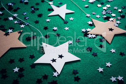Handmade stars on green background