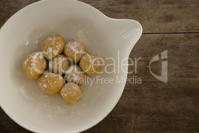 Round dough balls kept in a bowl