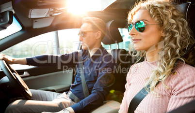 Couple doing test drive in car