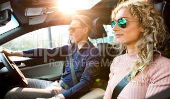 Couple doing test drive in car