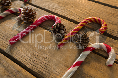 Colorful candy canes with pine cones