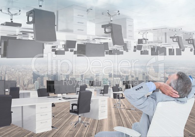 businessman sitting in inverted office with skyline