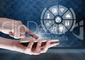 Hand holding phone with icons interface of internet of things