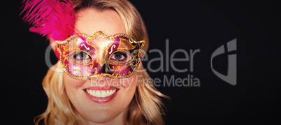 Portrait of happy woman in masquerade mask