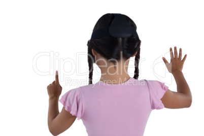 Girl using virtual reality headset against white background