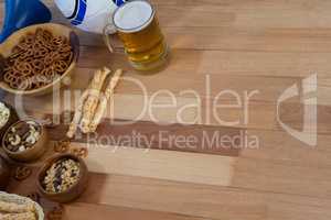 Fresh snacks and beer on wooden table