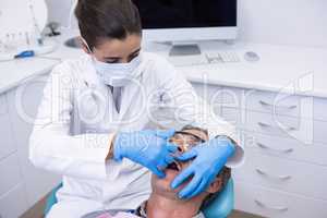 Close up of doctor giving dental treatment to patient