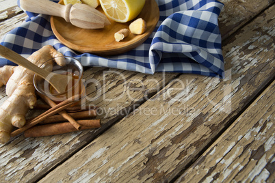 High angle view of various food with checked napkin on weathered table