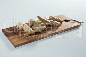 High angle view of fresh gingers on wooden serving board