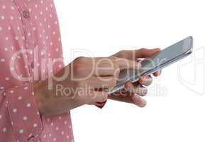 Mid-section of woman using digital tablet