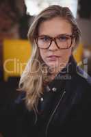 Portrait of confident young attractive woman wearing eyeglasses