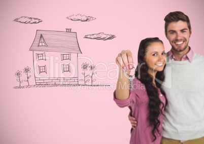Couple Holding key with house drawing in front of vignette