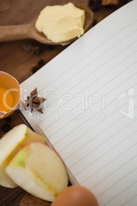 Overhead view of apple by book