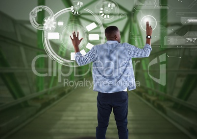 Businessman touching interface on green bridge