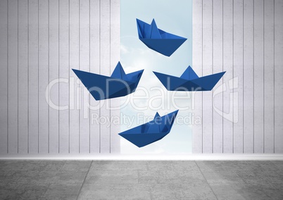 Blue paper boats floating in room