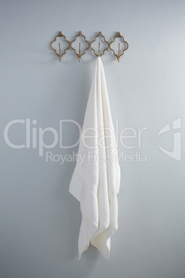 White towel hanging on hook