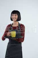 Waitress holding a tray of coffee cup against white background