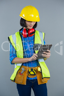 Female architect using digital tablet Female architect using digital tablet