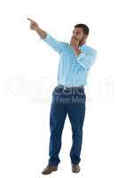 Male executive pointing against white background