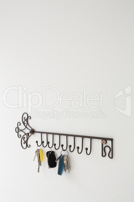 Various keys hanging on hook