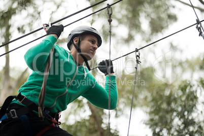 Man enjoying zip line adventure in park