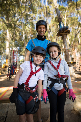 Kids and instructor standing together in park