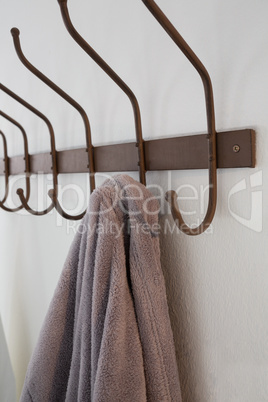 Close-up of bathrobe hanging on hook