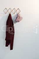 Warm clothes hanging on hook